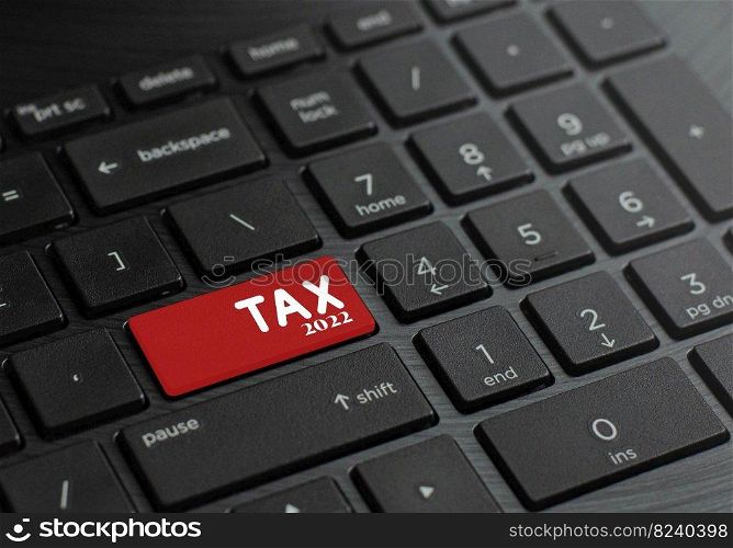 Computer keyboard with tax keys in 2022 to start this. and tax deducted from income and expenses in the year 2022