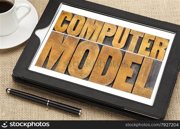 computer model typography - science or research concept - word abstract in letterpress wood type on a digital tablet
