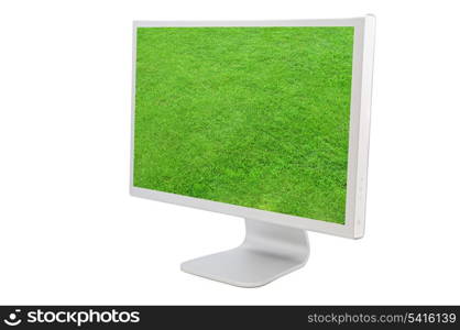 Computer monitor with the image of a green grass solated on white background