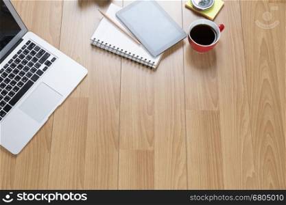 computer notebook, tablet on wooden office desk