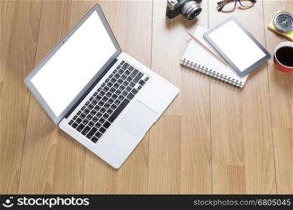 computer notebook, tablet on wooden office desk