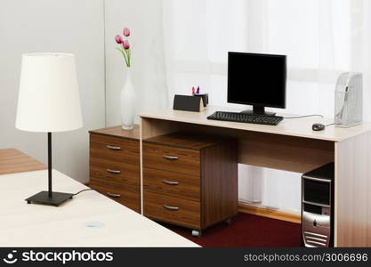 computer on a desk in a modern office