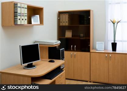 computer on a desk in a modern office