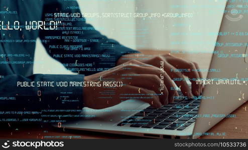 Computer programmer uses capable laptop computer to develop programming code of new software . Computer specialist working on future coding application for software programming development .. Computer programmer uses capable laptop computer to develop programming code