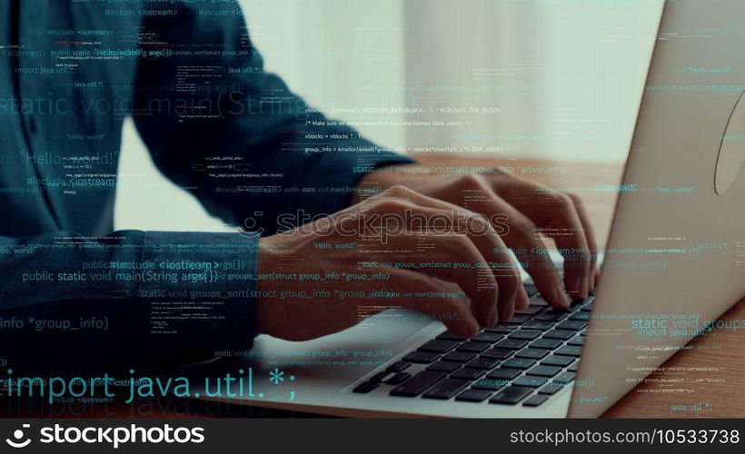 Computer programmer uses capable laptop computer to develop programming code of new software . Computer specialist working on future coding application for software programming development .. Computer programmer uses capable laptop computer to develop programming code
