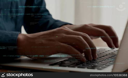 Computer programmer uses capable laptop computer to develop programming code of new software . Computer specialist working on future coding application for software programming development .. Computer programmer uses capable laptop computer to develop programming code