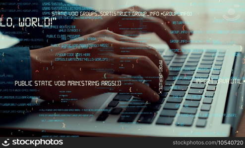Computer programmer uses capable laptop computer to develop programming code of new software . Computer specialist working on future coding application for software programming development .. Computer programmer uses capable laptop computer to develop programming code