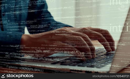 Computer programmer uses capable laptop computer to develop programming code of new software . Computer specialist working on future coding application for software programming development .. Computer programmer uses capable laptop computer to develop programming code
