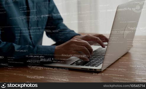 Computer programmer uses capable laptop computer to develop programming code of new software . Computer specialist working on future coding application for software programming development .. Computer programmer uses capable laptop computer to develop programming code