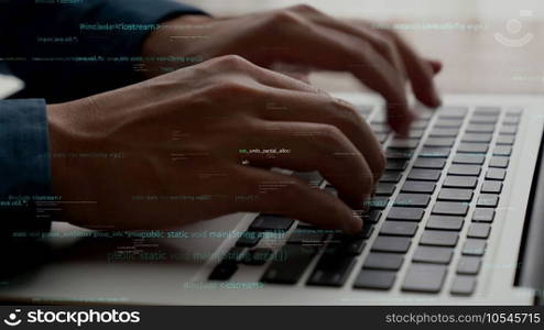 Computer programmer uses capable laptop computer to develop programming code of new software . Computer specialist working on future coding application for software programming development .. Computer programmer uses capable laptop computer to develop programming code