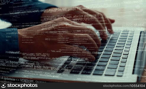 Computer programmer uses capable laptop computer to develop programming code of new software . Computer specialist working on future coding application for software programming development .. Computer programmer uses capable laptop computer to develop programming code