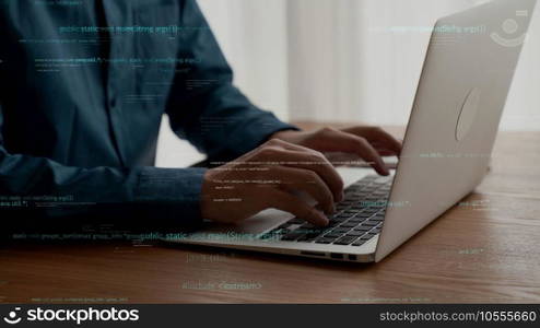 Computer programmer uses capable laptop computer to develop programming code of new software . Computer specialist working on future coding application for software programming development .. Computer programmer uses capable laptop computer to develop programming code