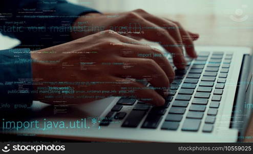 Computer programmer uses capable laptop computer to develop programming code of new software . Computer specialist working on future coding application for software programming development .. Computer programmer uses capable laptop computer to develop programming code