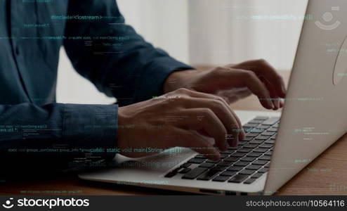Computer programmer uses capable laptop computer to develop programming code of new software . Computer specialist working on future coding application for software programming development .. Computer programmer uses capable laptop computer to develop programming code