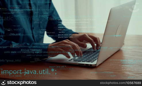 Computer programmer uses capable laptop computer to develop programming code of new software . Computer specialist working on future coding application for software programming development .. Computer programmer uses capable laptop computer to develop programming code