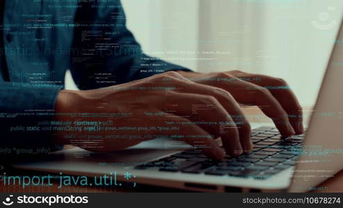Computer programmer uses capable laptop computer to develop programming code of new software . Computer specialist working on future coding application for software programming development .. Computer programmer uses capable laptop computer to develop programming code