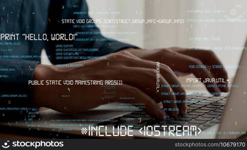 Computer programmer uses capable laptop computer to develop programming code of new software . Computer specialist working on future coding application for software programming development .. Computer programmer uses capable laptop computer to develop programming code