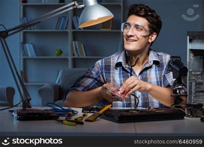 Computer repair concept with man inspecting with stethoscope