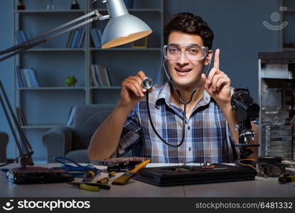 Computer repair concept with man inspecting with stethoscope