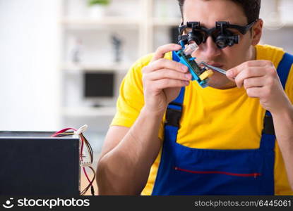 Computer repair technician repairing hardware