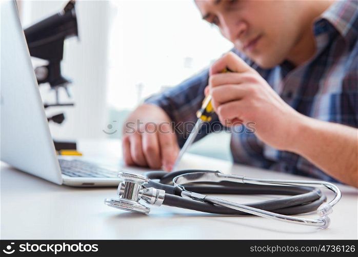 Computer repairman repairing computer laptop