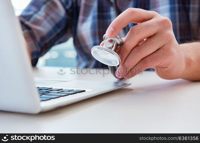 Computer repairman repairing computer laptop