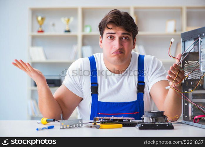 Computer repairman repairing desktop computer