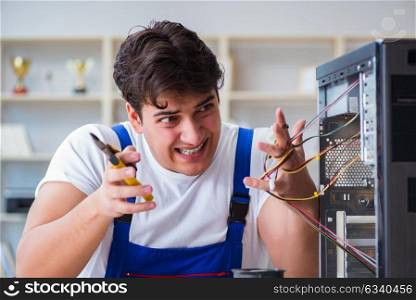 Computer repairman repairing desktop computer