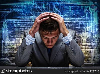 Computer safety. Troubled thoughtful businessman with hands on head