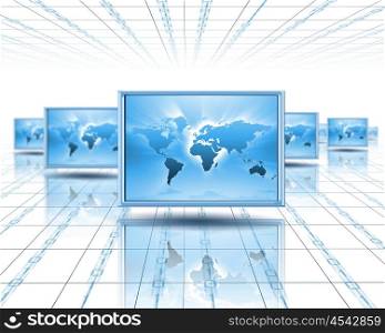 Computer screens with an image of the world on them&gt;