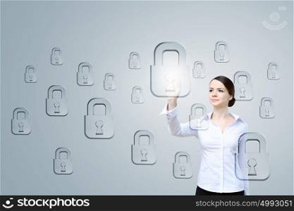 Computer security and privacy. Attractive businesswoman touching with finger media lock icon