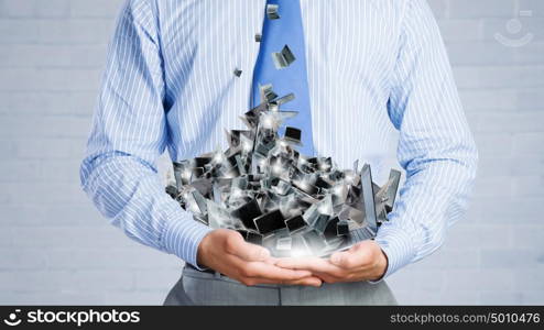 Computer service. Close up of businessman&rsquo;s hands holding many laptops