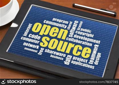 computer software development concept - open source word cloud on a digital tablet