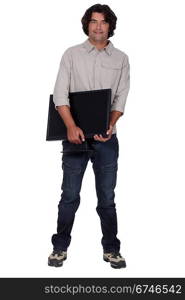 Computer technician holding monitor