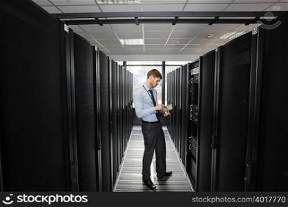 Computer technician working on a server