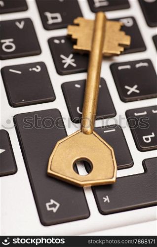 Computer with key. internet and network security concept.