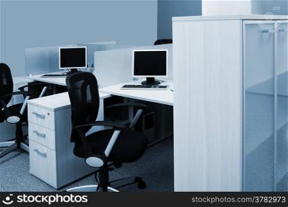 computers on a desk in a modern office