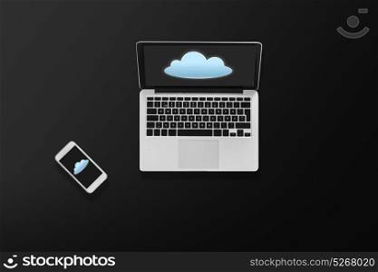 computing and technology concept - laptop computer with cloud icon on screen and smartphone top view. laptop computer with cloud icon and smartphone