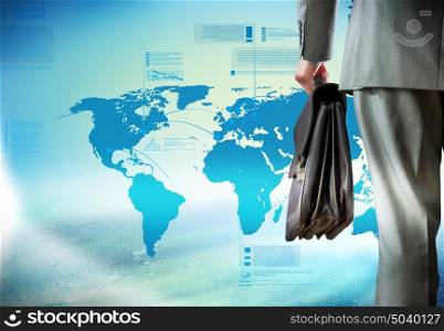 Computing concept. Bottom view of businessman with suitcase in hand