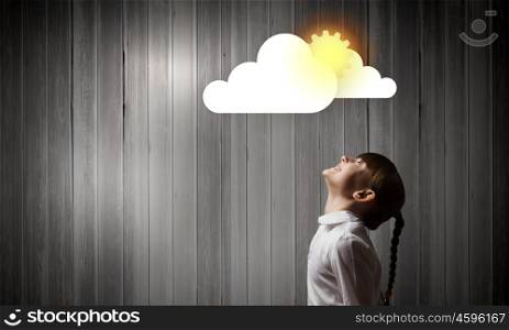 Computing concept. Side view of cute girl and media cloud above her head