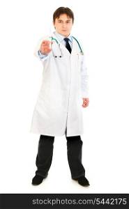 Concentrated medical doctor holding medical syringe in hand isolated on white&#xA;