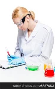 Concentrated microbiologist with a test tube while working