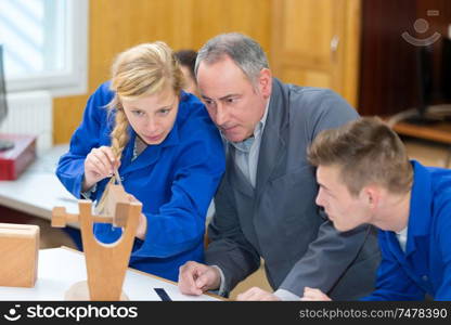 concentrated woman as carpenter trainee