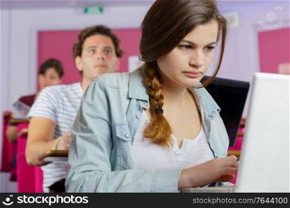 concentrated woman looking at pc
