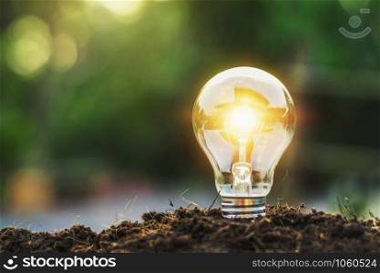 concept idea saving energy light bulb and sunlight