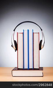 Concept of audio books with earphones on white