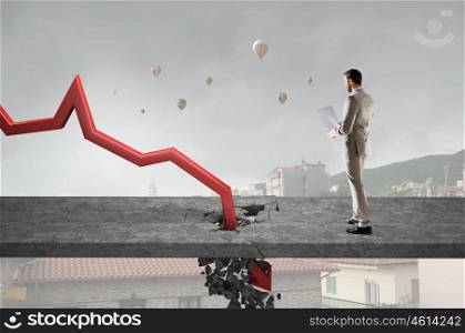 Concept of business collapse. Businessman and red decreasing arrow breaking through floor