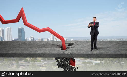 Concept of business collapse. Businessman and red decreasing arrow breaking through floor