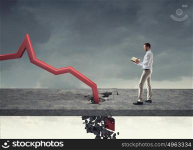Concept of business collapse. Businessman and red decreasing arrow breaking through floor