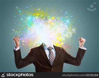 Concept of creative idea of a businessman. Colorful splashes streaming out of him. No head